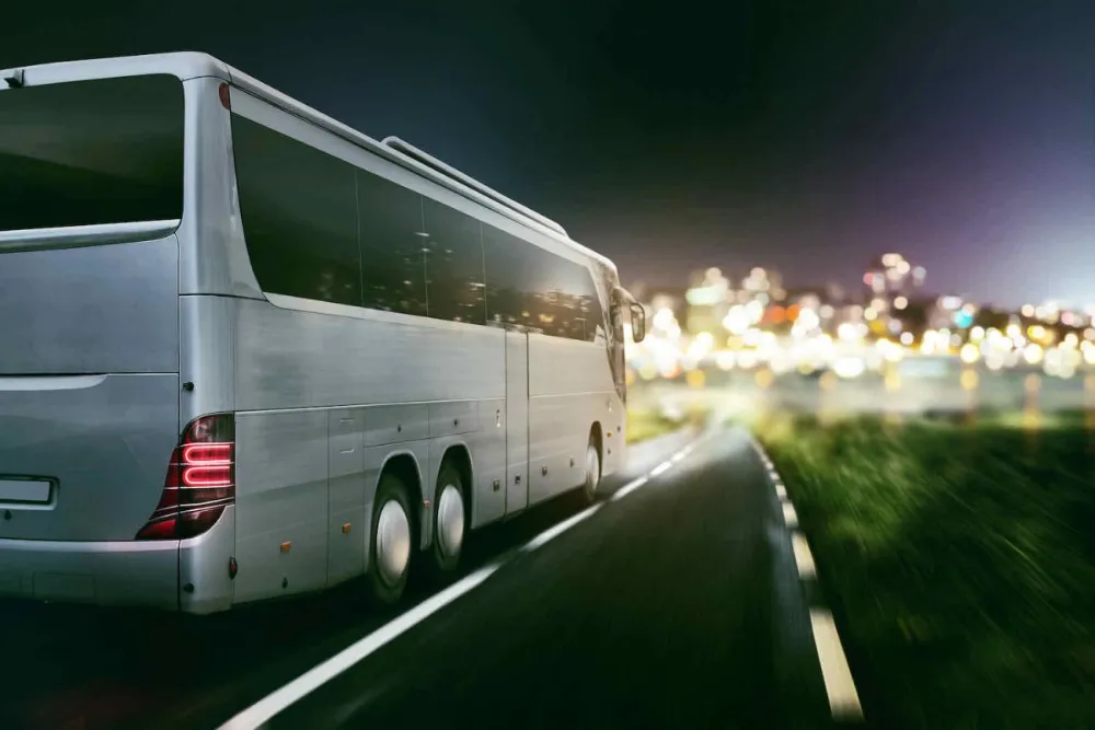 40 passenger coach bus on a Bay Area highway at night