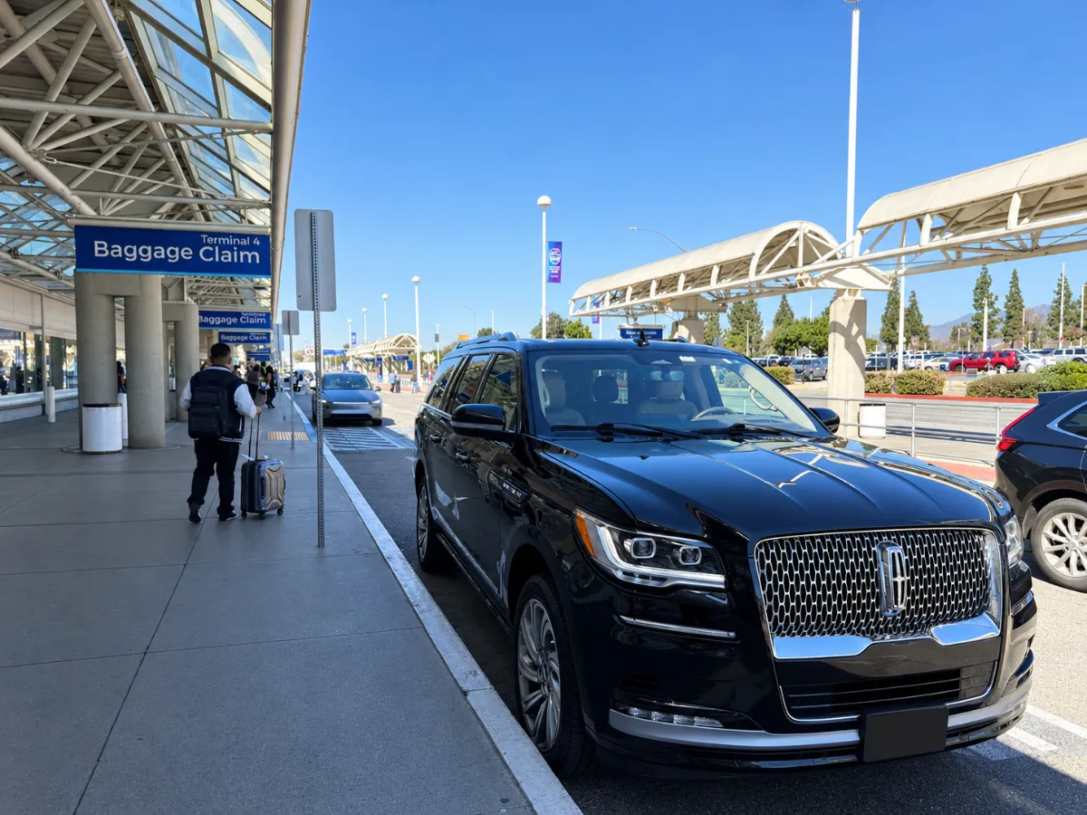 Black Lincoln Navigator at the San Jose Airport SJC curb for private airport transportation