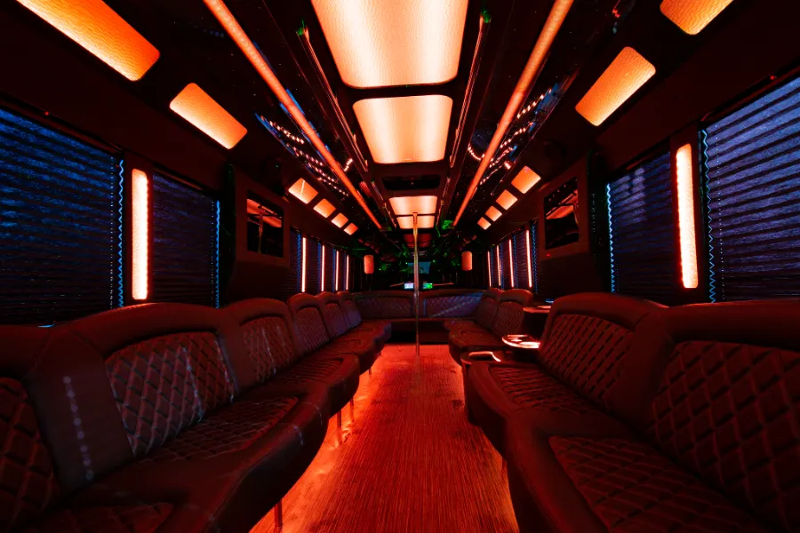 40 passenger party bus interior with red LED lighting and wraparound seating
