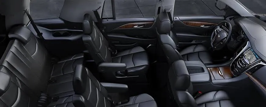 Cadillac Escalade interior with black leather seats across three rows