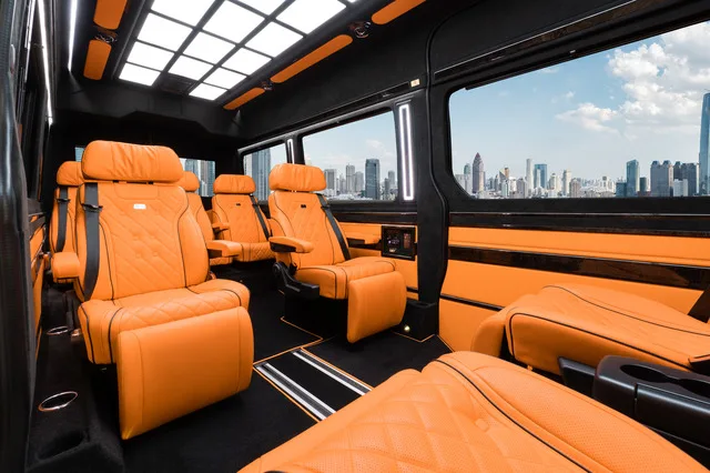 Jet Sprinter VIP cabin with tan leather captain seats and a lighted ceiling