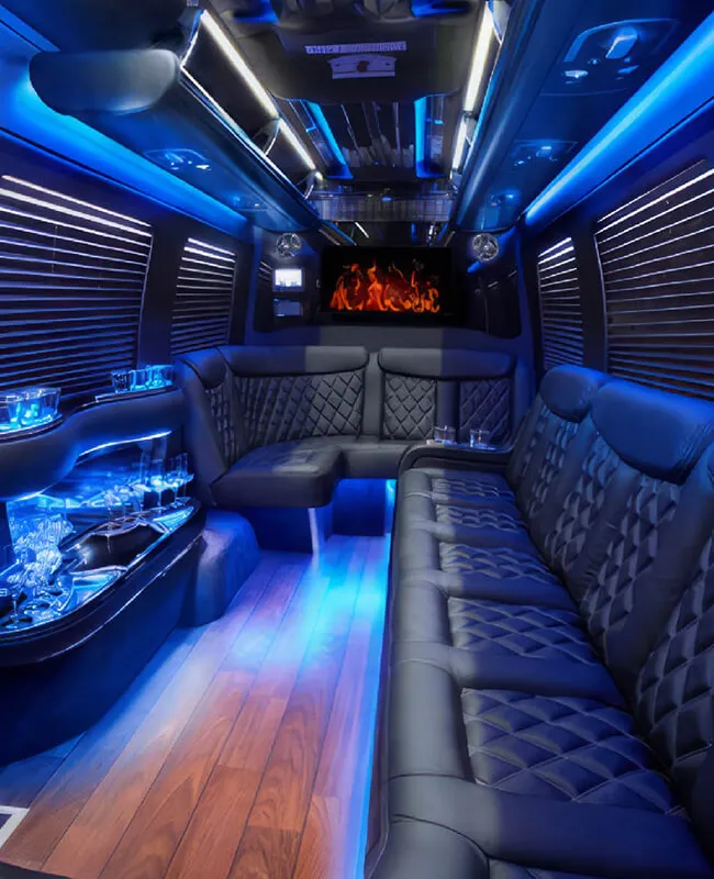 Limo Sprinter interior with blue LED lighting, quilted leather seats and wood floor